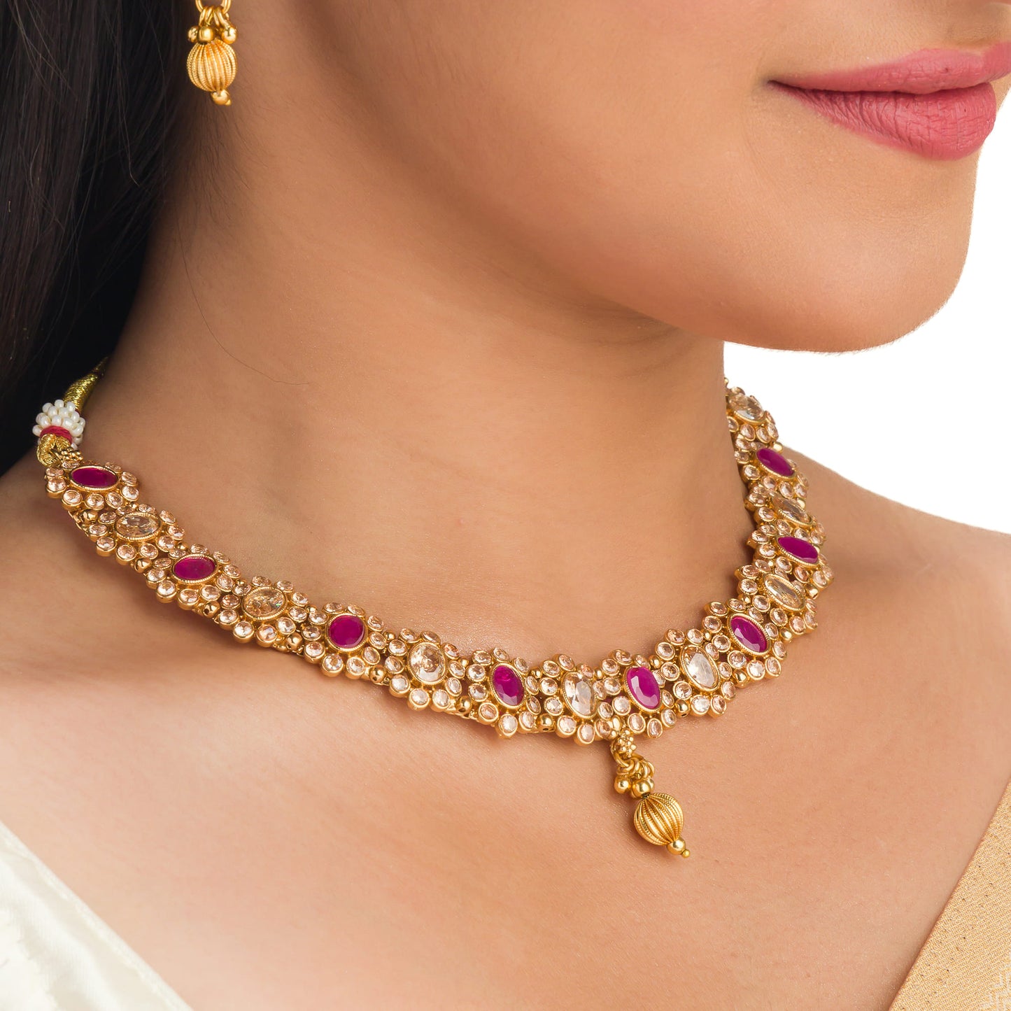 GOLD TONE NECKLACE WITH PINK STONE