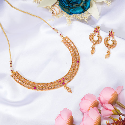 GOLD TONE NECKLACE WITH PINK STONE