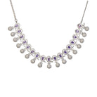 Violet zircon necklace adds a rich, sophisticated touch to festive looks.
