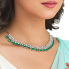 Green flower-shaped zircon necklace with silver polish for modern elegance.
