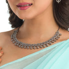 S-shaped black zircon necklace adds sleek, flowing elegance for a chic look.
