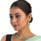 Light green zircon necklace adds a fresh, elegant touch to your festival style.
