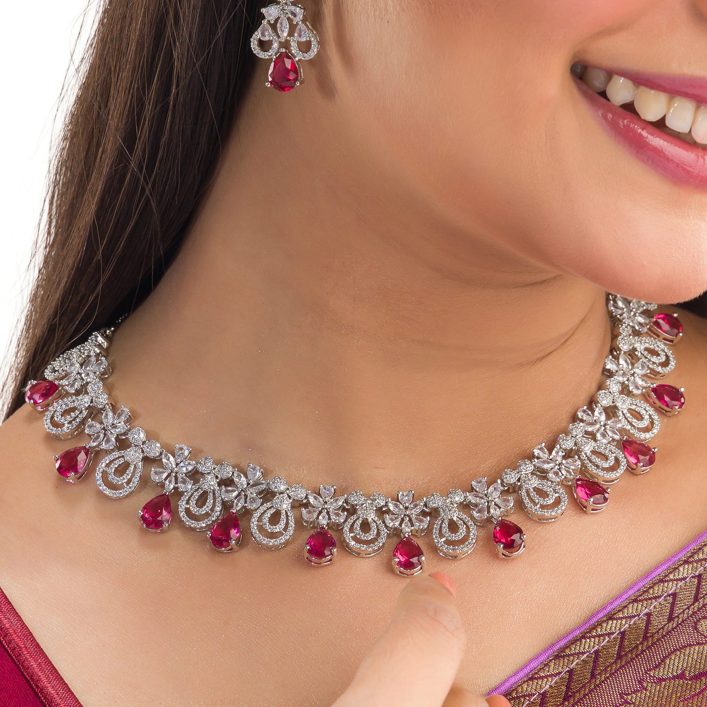 A stunning red and clear necklace set adds a bold, elegant touch to any outfit.