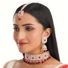 Regal maroon Kundan bridal choker set for a traditional, stunning bridal touch
