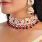 Regal maroon Kundan bridal choker set for a traditional, stunning bridal touch
