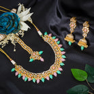 Elegant bridal choker set with green and pink Kundan, adding a traditional, regal touch
