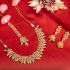 Elegant bridal choker set with green and pink Kundan, adding a traditional, regal touch
