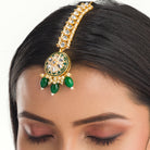 Regal green Kundan bridal choker set for a stunning and traditional bridal look
