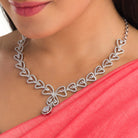 Trendy leaf-shaped silver necklace with white drops for a chic, modern style
