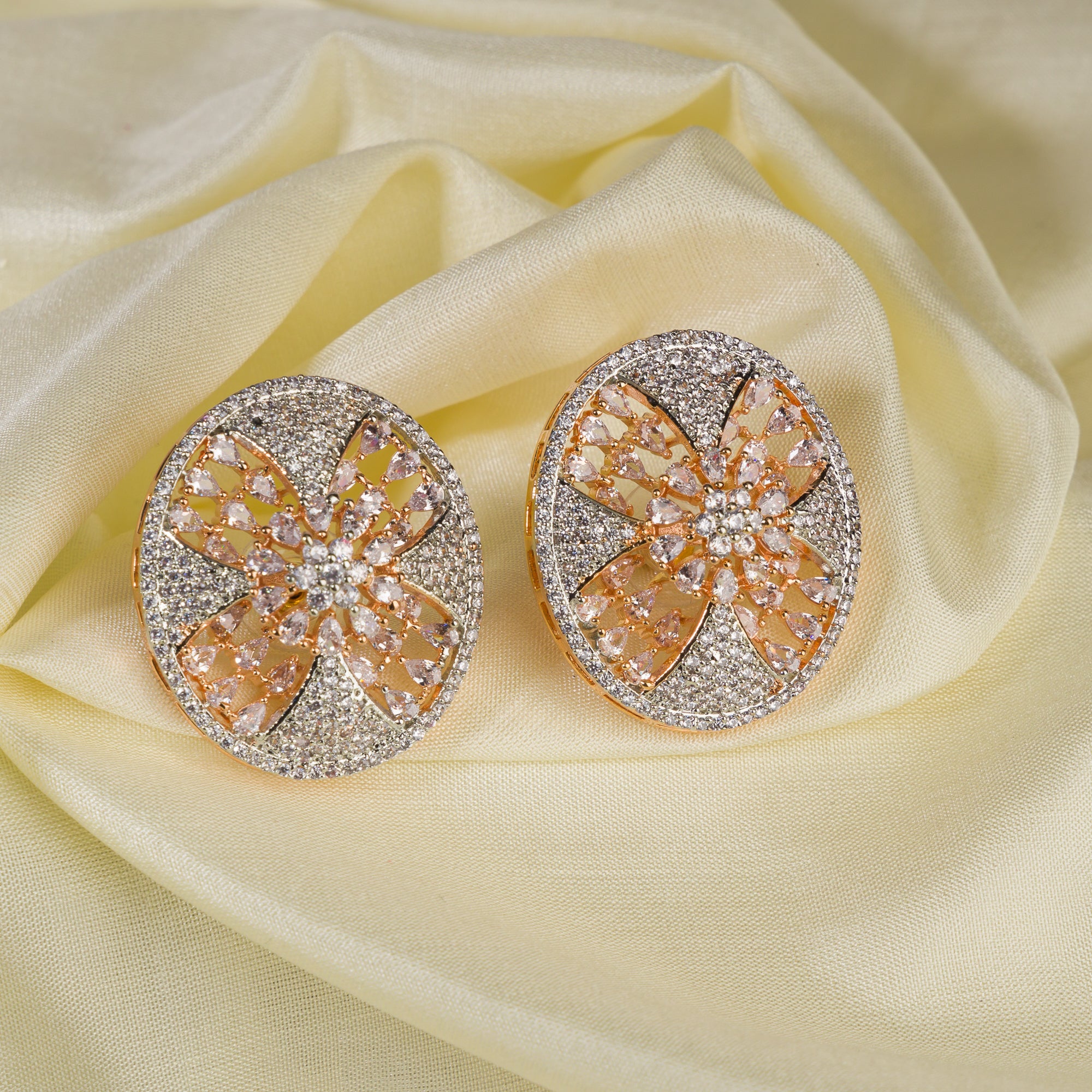 Gold-tone zircon round stud earrings add elegant sparkle for a sophisticated look.
