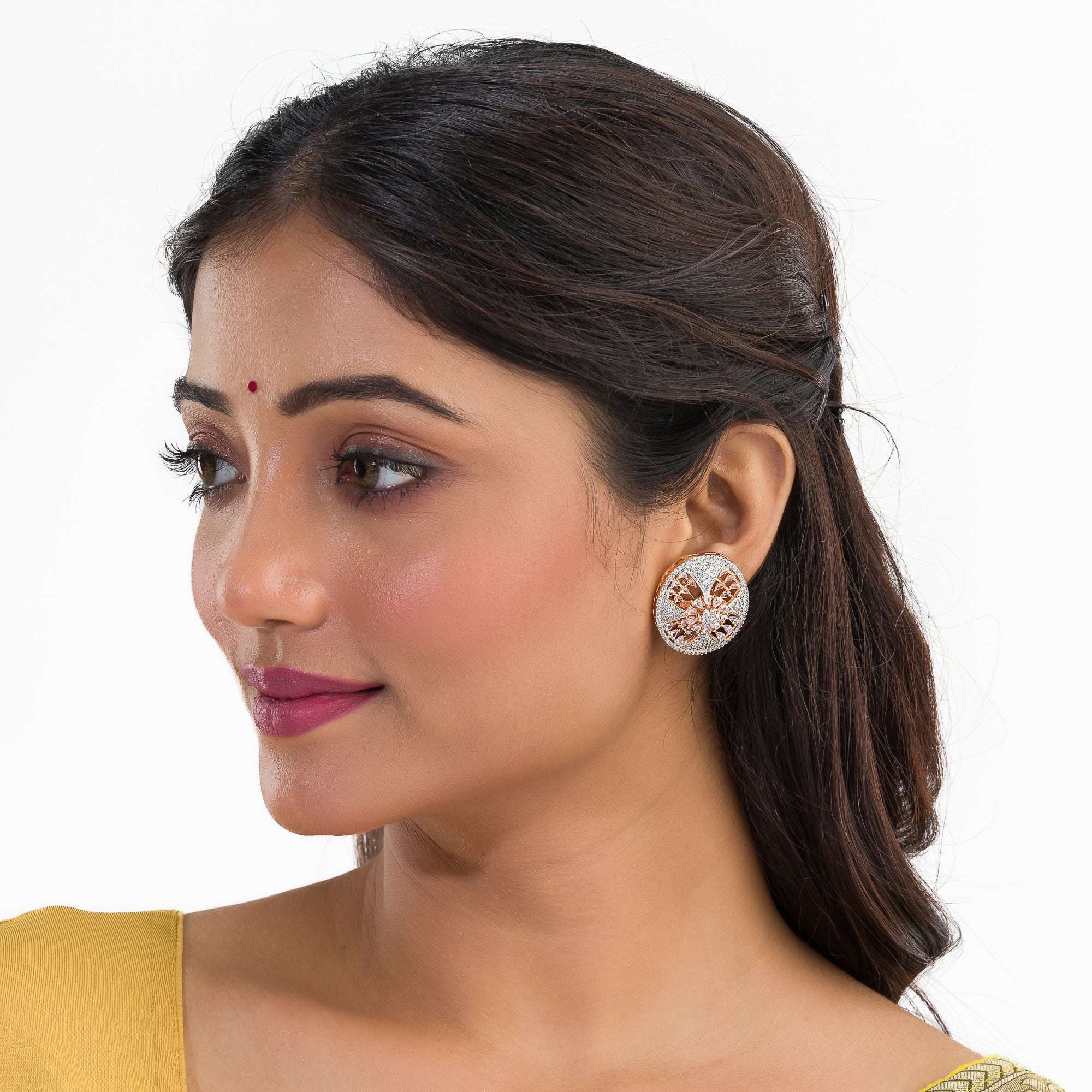 Gold-tone zircon round stud earrings add elegant sparkle for a sophisticated look.
