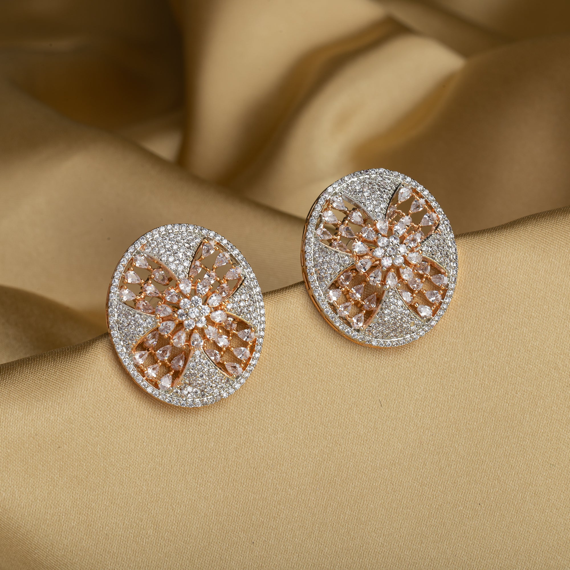 Gold-tone zircon round stud earrings add elegant sparkle for a sophisticated look.
