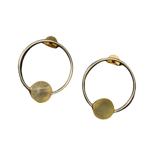 Classic round gold-tone earrings with wheat stones add a warm, sophisticated touch.
