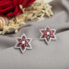 Trendy star-shaped pink zircon studs bring a modern, playful sparkle to your look.
