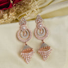 Sparkling zircon dangler earrings in rose gold, perfect for party elegance.
