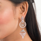 Sparkling zircon dangler earrings in rose gold, perfect for party elegance.
