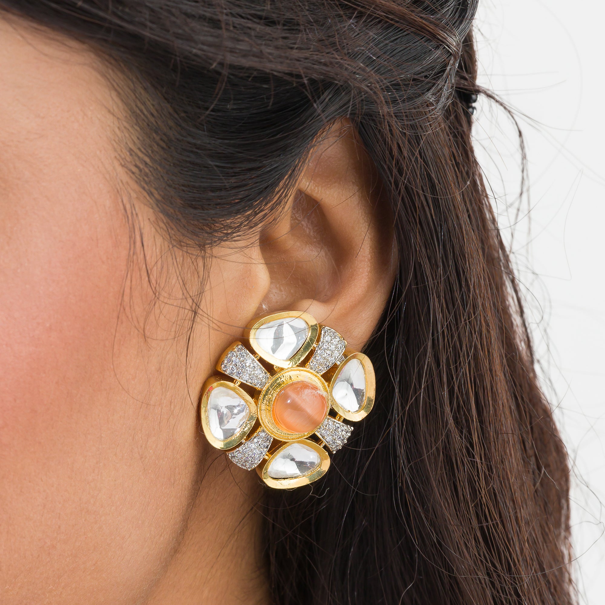 Orange zircon stud earrings with white accents, offering a pop of color and sparkle.
