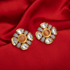 Orange zircon stud earrings with white accents, offering a pop of color and sparkle.
