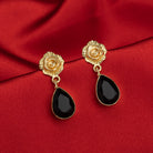 "Rose-design gold-tone stud earrings add timeless elegance for casual wear."
