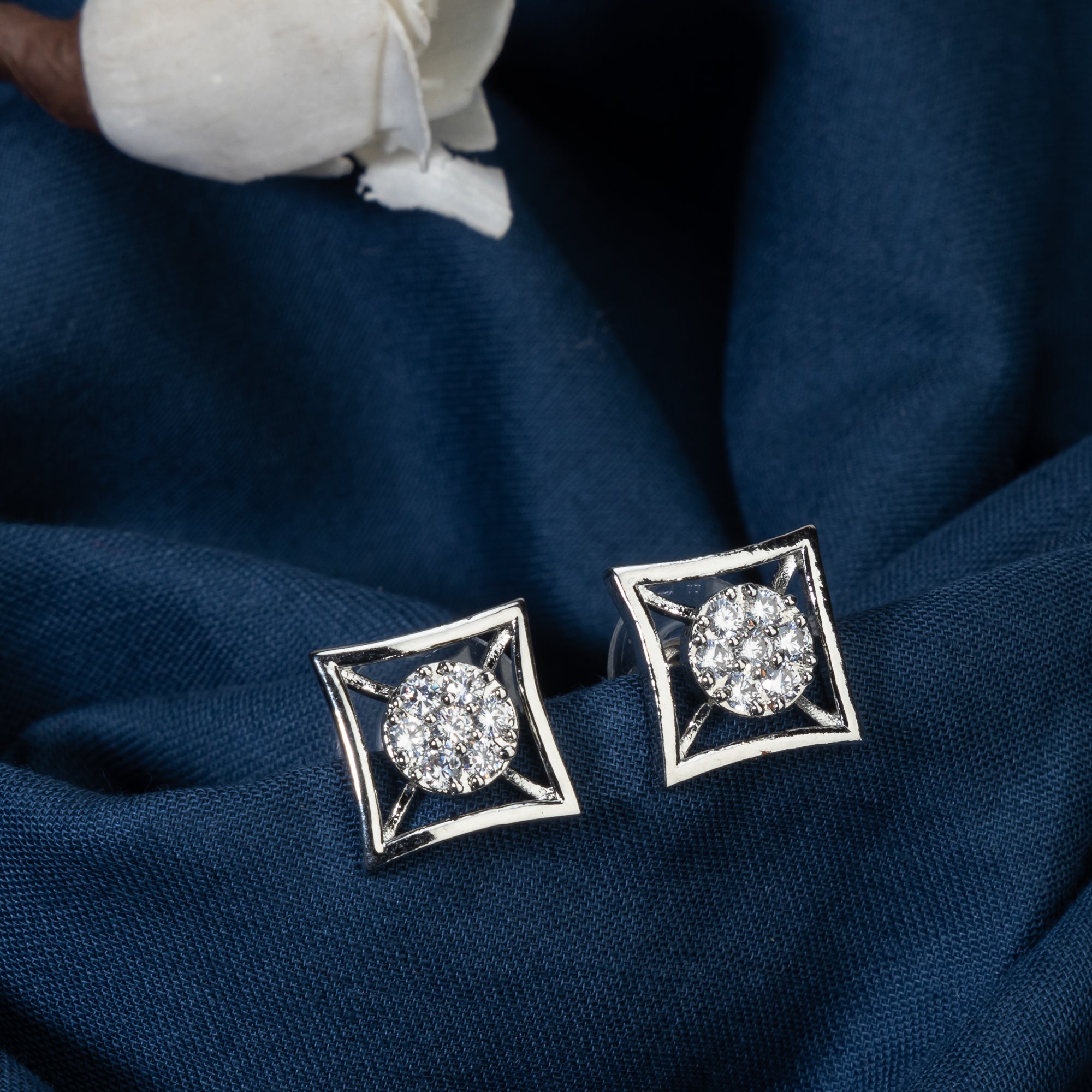 "Silver square zircon earrings bring modern sophistication and subtle sparkle for office wear."
