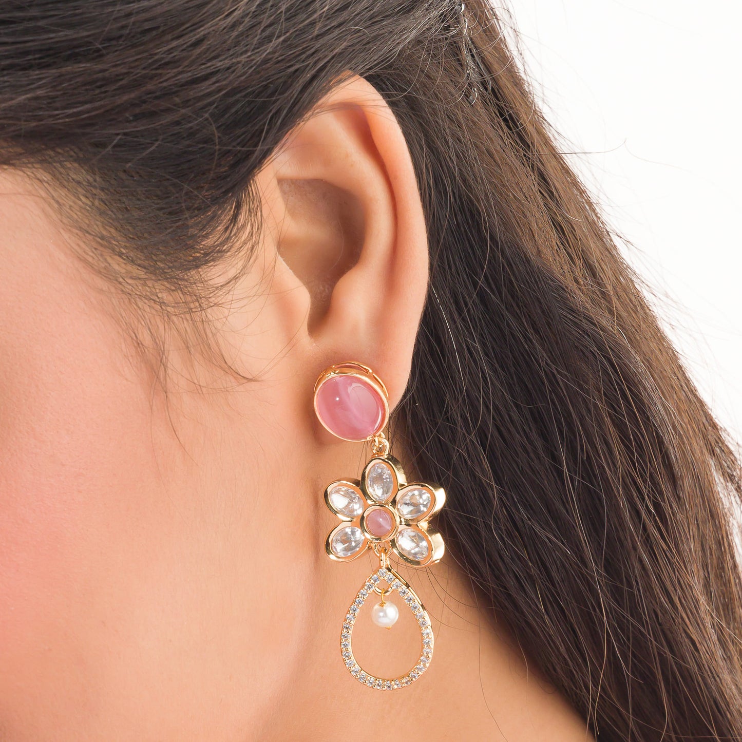 SMALL ORCHID-COLORED GOLD-TONE DANGLERS OFFER A SUBTLE YET SOPHISTICATED POP OF COLOR AND SHINE.