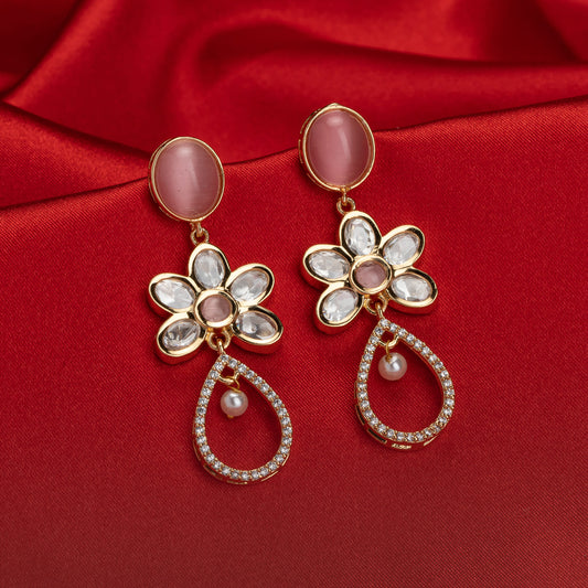 SMALL ORCHID-COLORED GOLD-TONE DANGLERS OFFER A SUBTLE YET SOPHISTICATED POP OF COLOR AND SHINE.