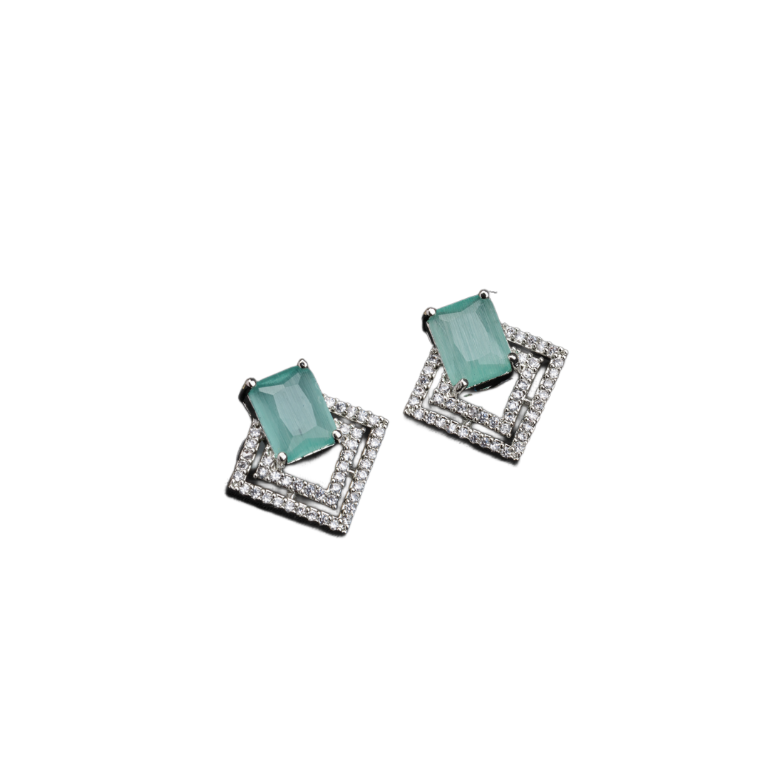 "Light green zircon studs sparkle with elegance, adding vibrant color to your casual look."
