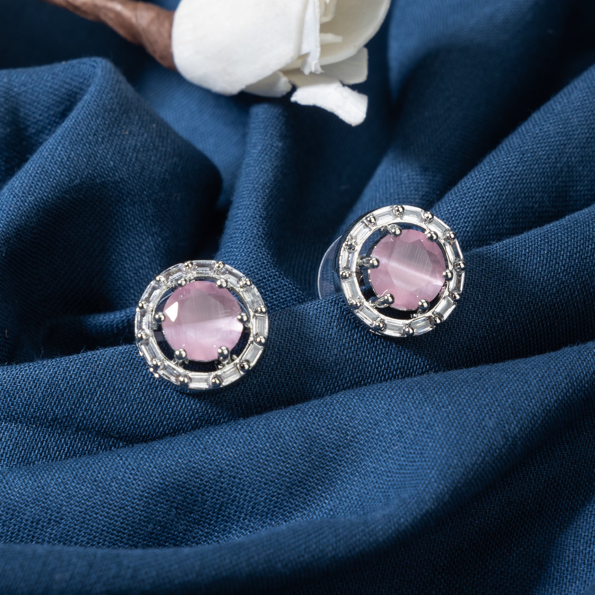 "Pink zircon stud earrings bring stunning sparkle and a vibrant, elegant touch to any look."
