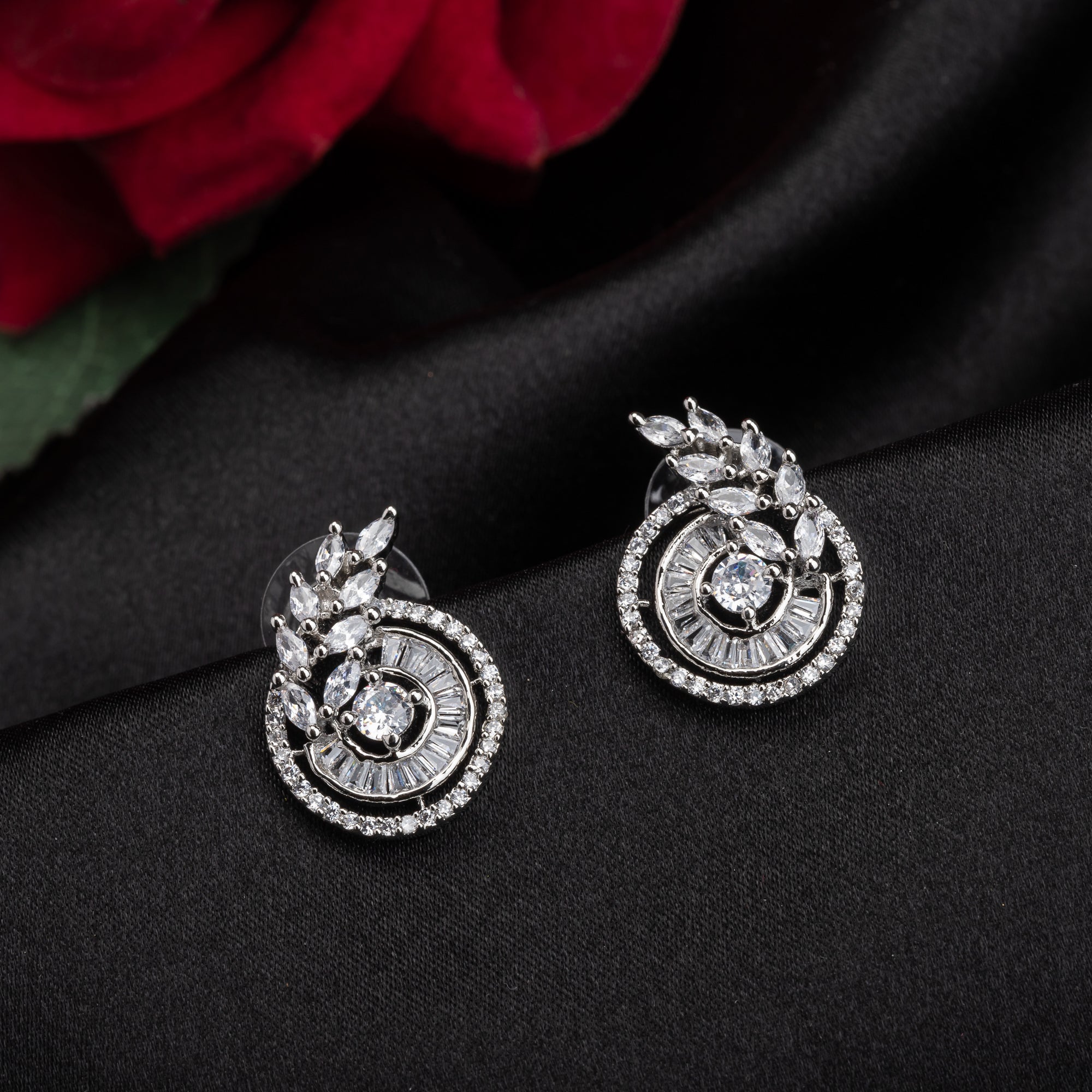  "Round and leaf zircon earrings combine sparkling beauty with nature-inspired, elegant charm."
