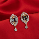  "Zircon earrings with a golden touch combine sparkling brilliance and a warm, luxurious finish."
