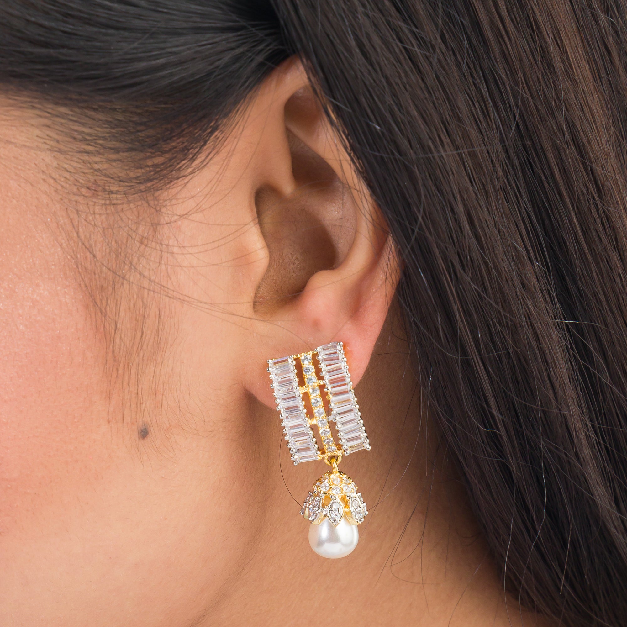 "Gold zircon square earrings with clean lines and vibrant, chic sparkle."
