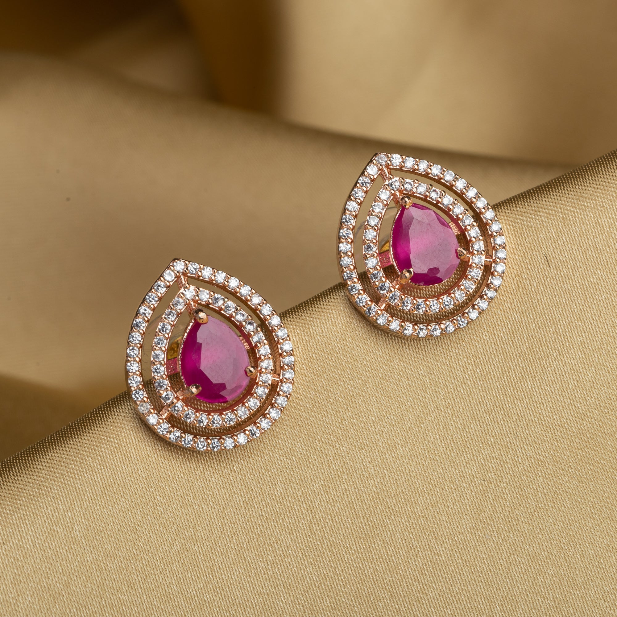 Pink zircon earrings offering vibrant elegance with a sparkling, romantic touch.
