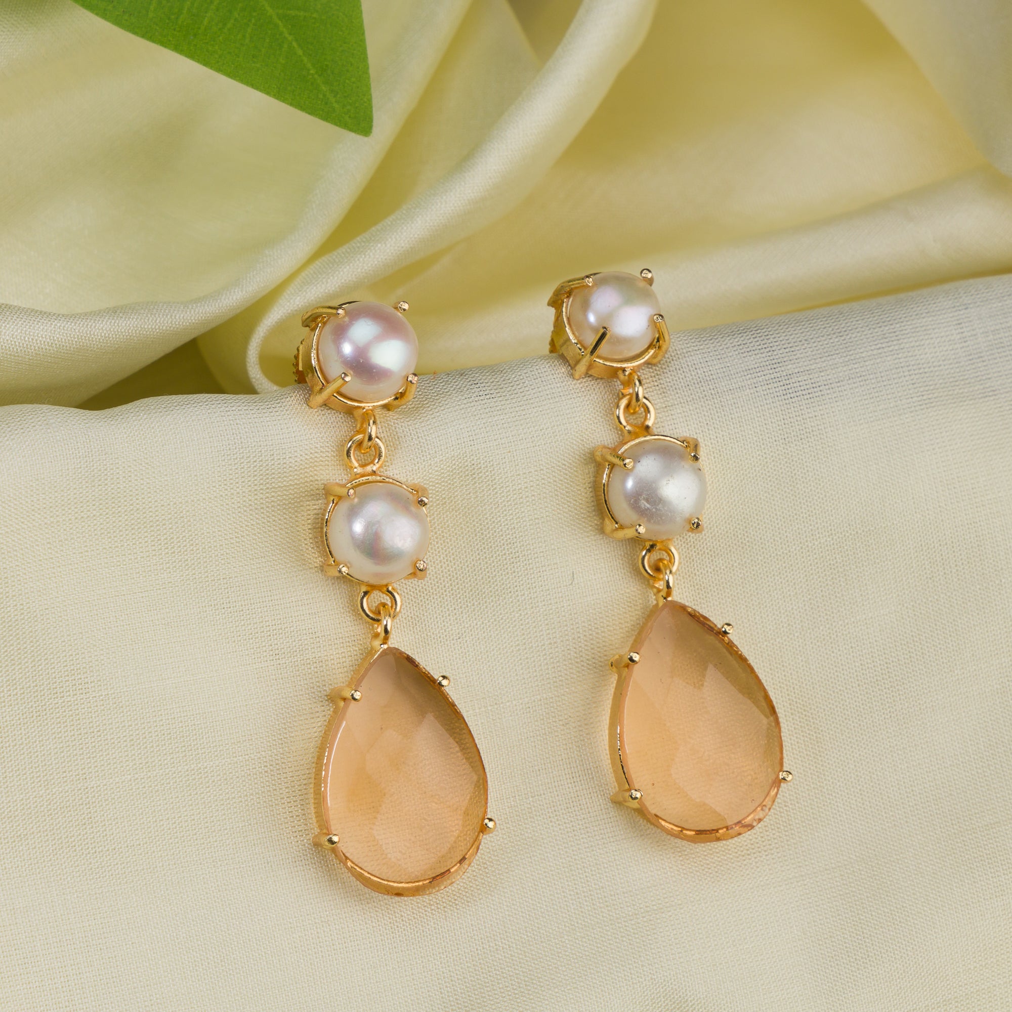 "Trendy gold-tone dangler earrings with pearls for a subtle chic touch.
"
