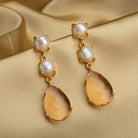 "Trendy gold-tone dangler earrings with pearls for a subtle chic touch.
"
