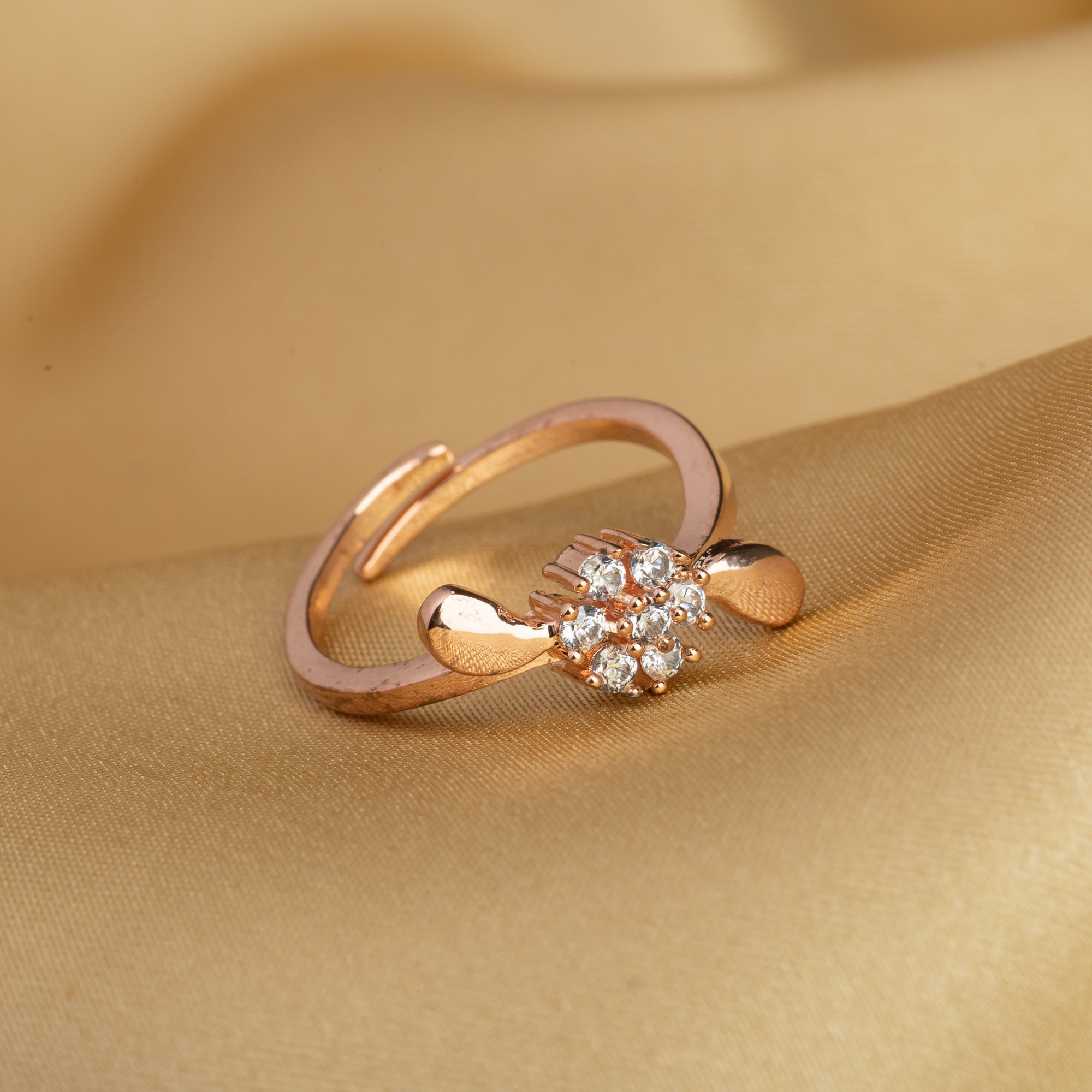  Rose gold flower-shaped zircon finger ring blending delicate design with warmth.
