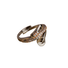 The gold-tone zircon finger ring adds a subtle yet sophisticated sparkle to any outfit.
