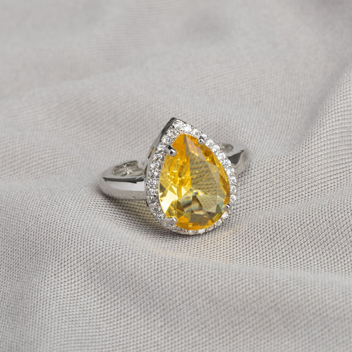 ZIRCON STONES STUDDED FINGER RING WITH YELLOW STONE