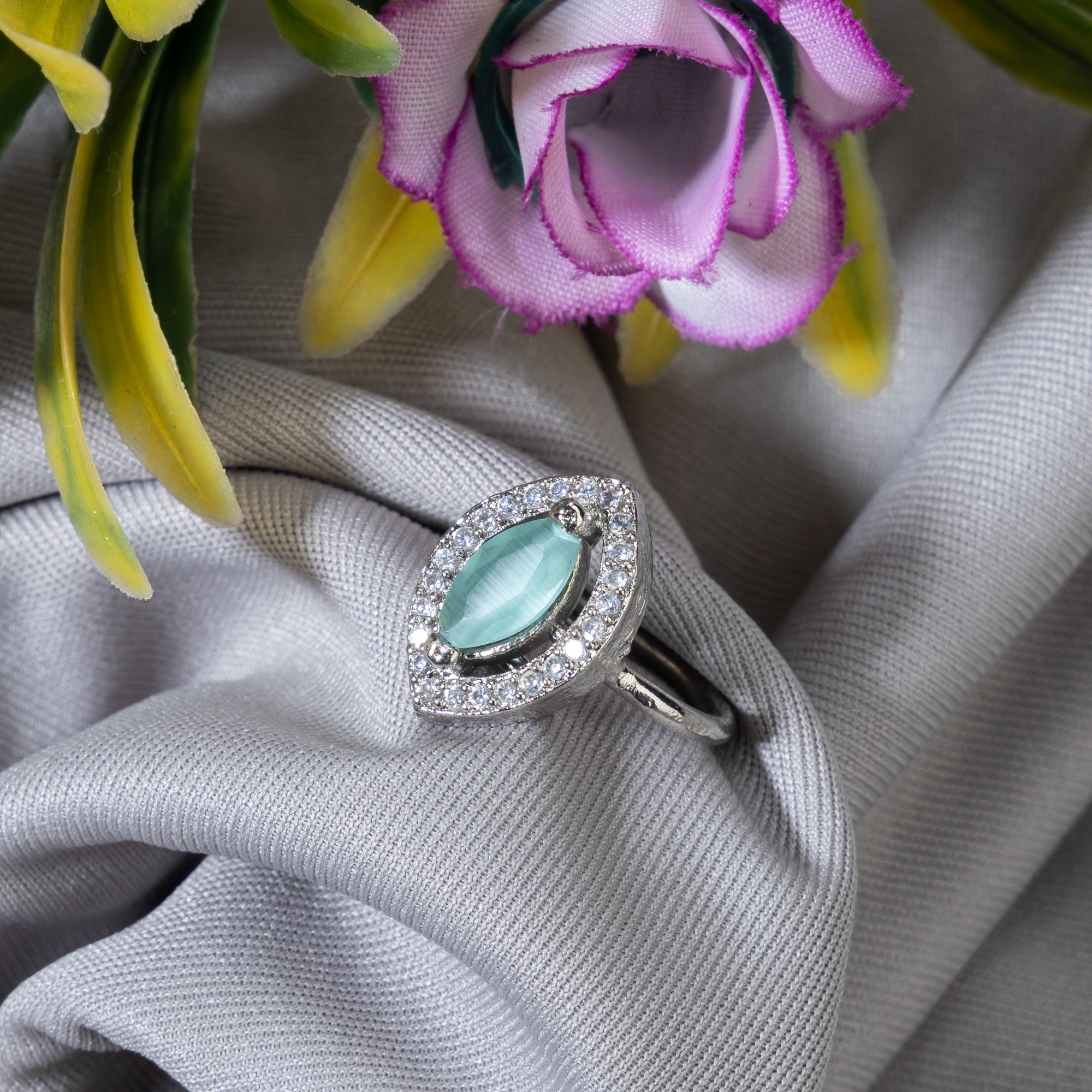 Zircon finger ring with turquoise stone adds a serene and chic sparkle for any occasion.
