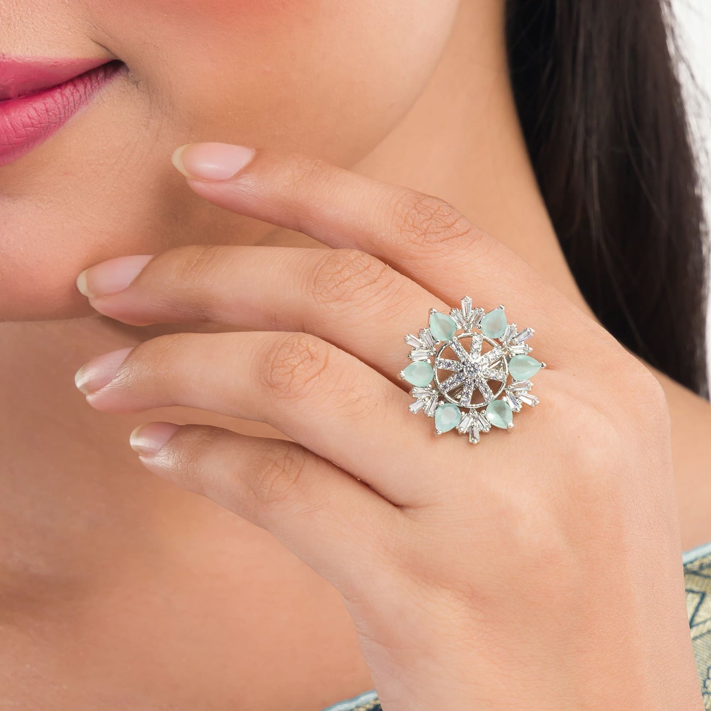 AQUA- COLOURED STONE STUDDED FLORAL DESIGN ZIRCON FINGER RING WITH AQUA- COLOURED STONE