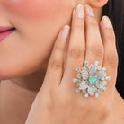 Aqua zircon floral finger ring in silver brings a fresh, vibrant charm to your party style.
