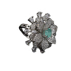 Aqua zircon floral finger ring in silver brings a fresh, vibrant charm to your party style.
