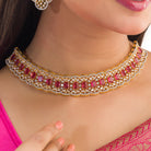 Red zircon bridal necklace set features intricate designs, perfect for a regal wedding look.
