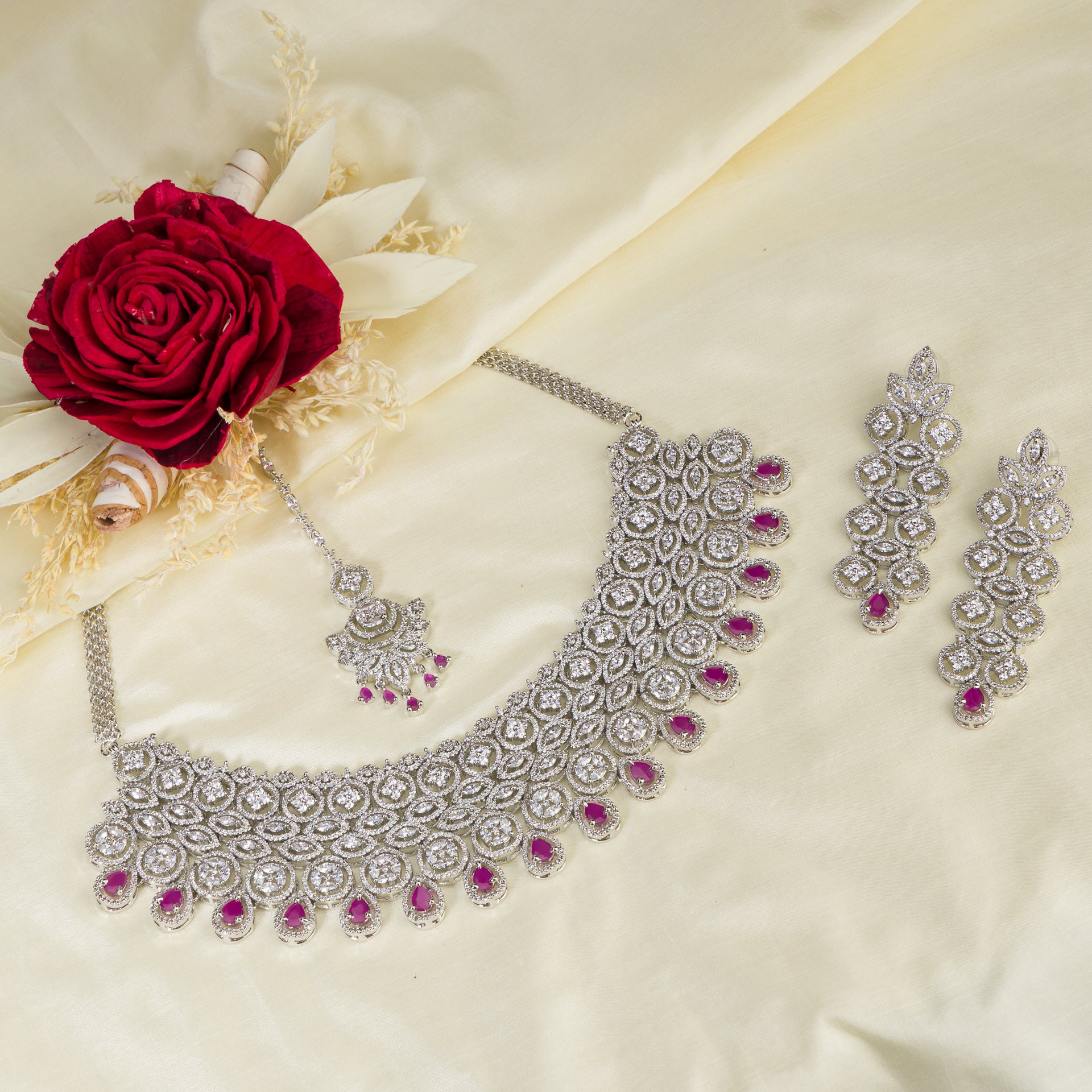 THIS STUNNING PINK COLOUR STONE-STUDDED ZIRCON BRIDAL SET