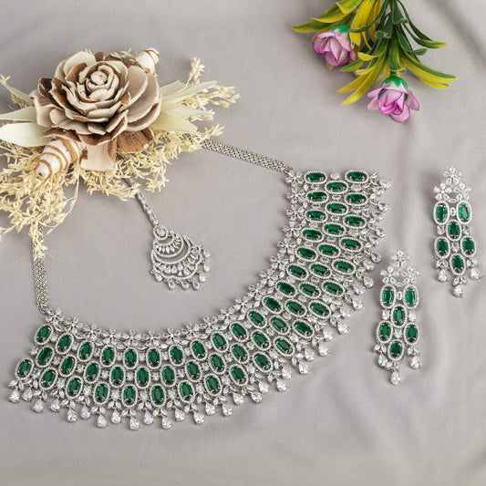 GREEN STONE-STUDDED ZIRCON BRIDAL SET FEATURES A DAZZLING NECKLACE PERFECT FOR A REGAL BRIDAL LOOK.