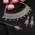 Pink pearl and white zircon bridal choker set with earrings and maangtika.
