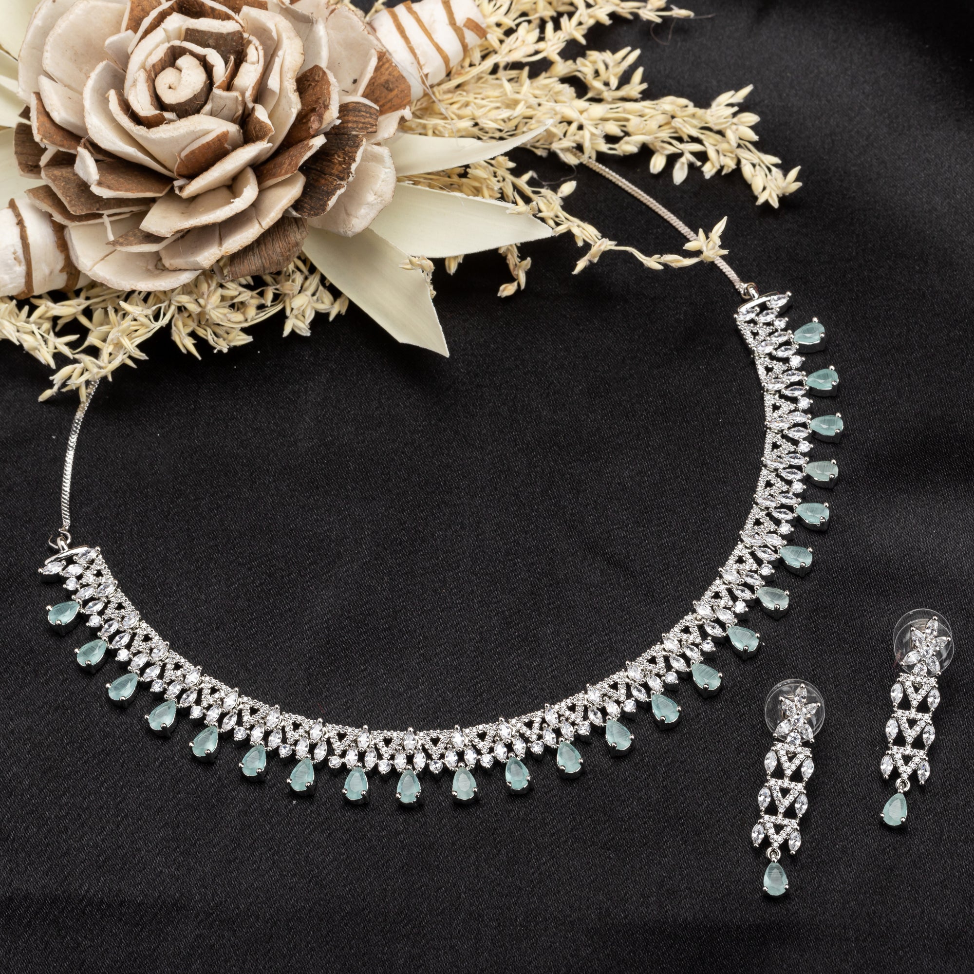 Aqua zircon-studded necklace set for elegance and charm, perfect for special occasions.
