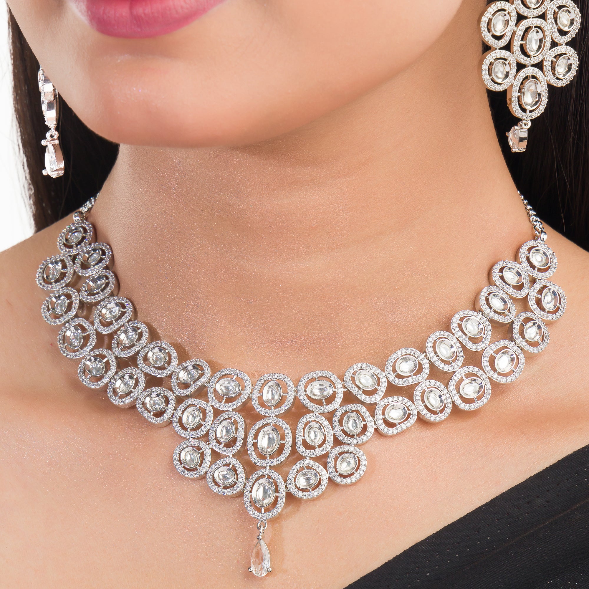 White zircon short necklace set with matching earrings for timeless elegance and sophistication.
