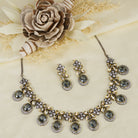 Black polished zircon necklace set with matching earrings for a sleek and stylish festive look.
