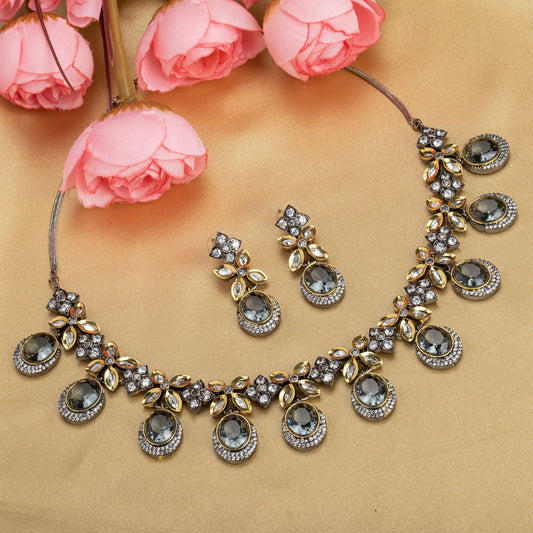 BLACK POLISHED ZIRCON-STUDDED NECKLACE SET WITH MATCHING EARRINGS, OFFERING A SLEEK AND STYLISH LOOK.