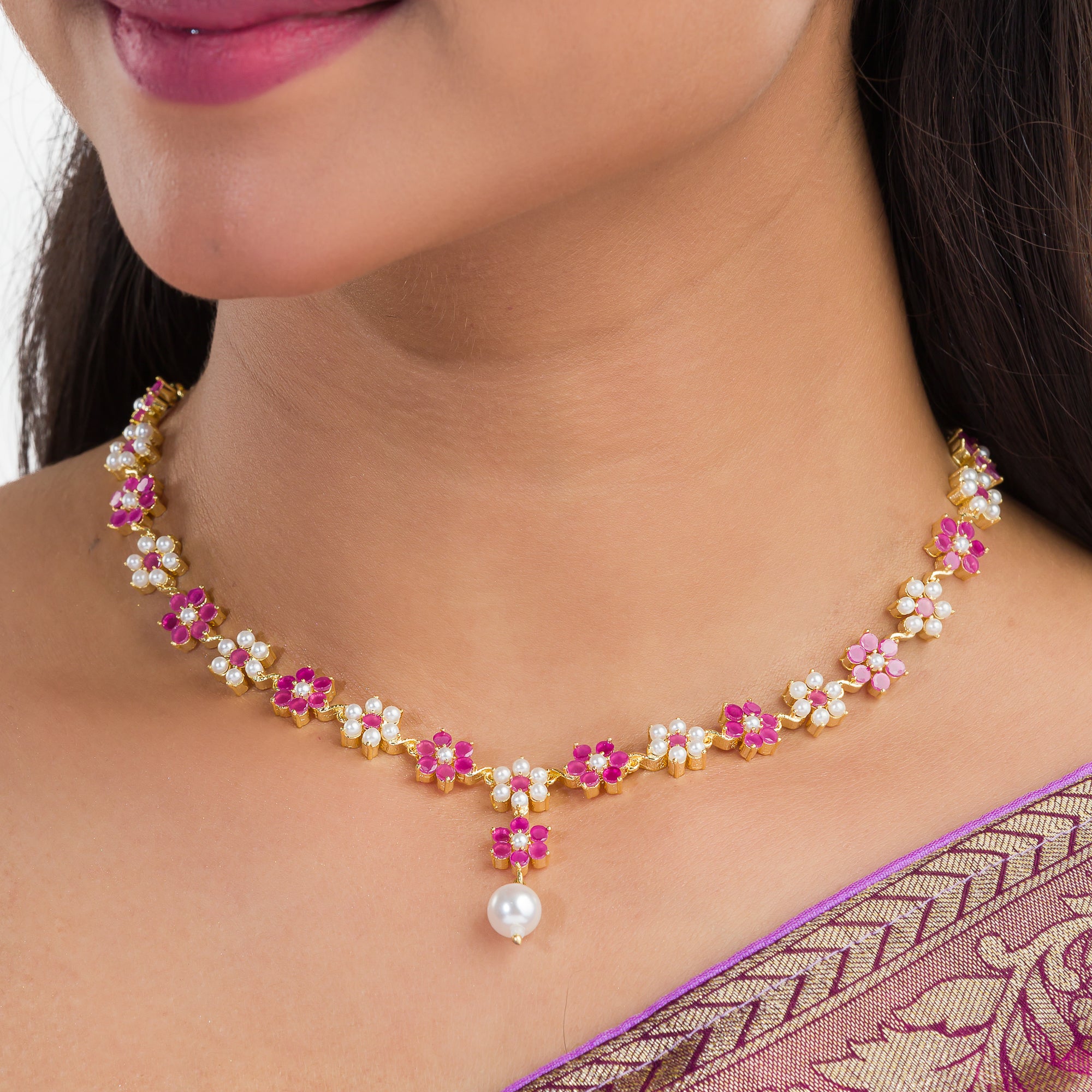 Pink pearl floral necklace set with matching earrings for timeless elegance and beauty.
